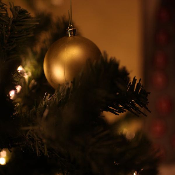 Person stretching deeply in a brightly lit, serene environment.